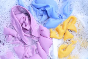 Professional office clothing care with freshly washed formal shirts and trousers