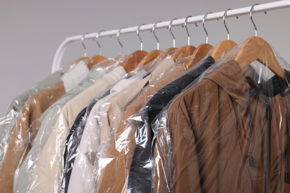 Properly folded seasonal clothes stored neatly in a clean wardrobe