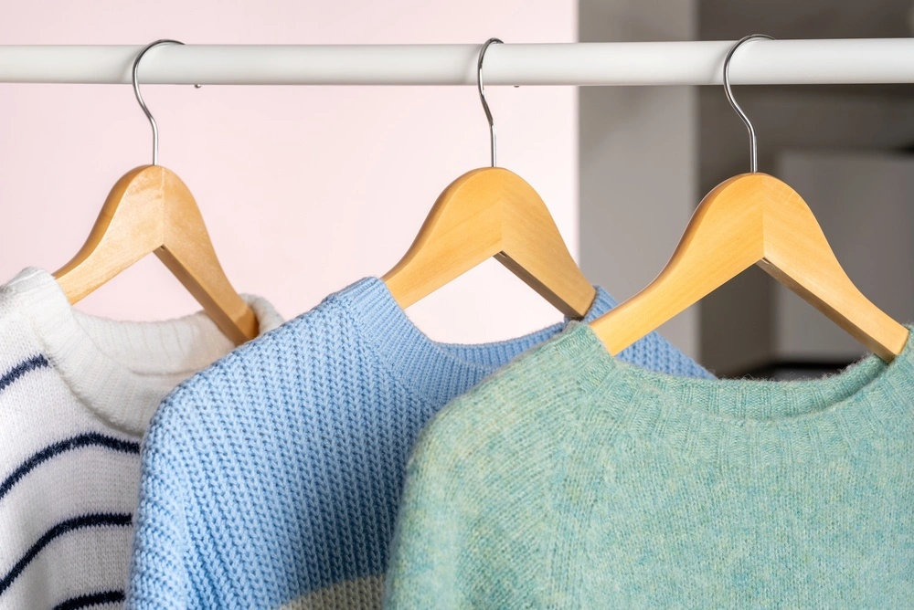 Seasonal clothes neatly folded and organized for storage
