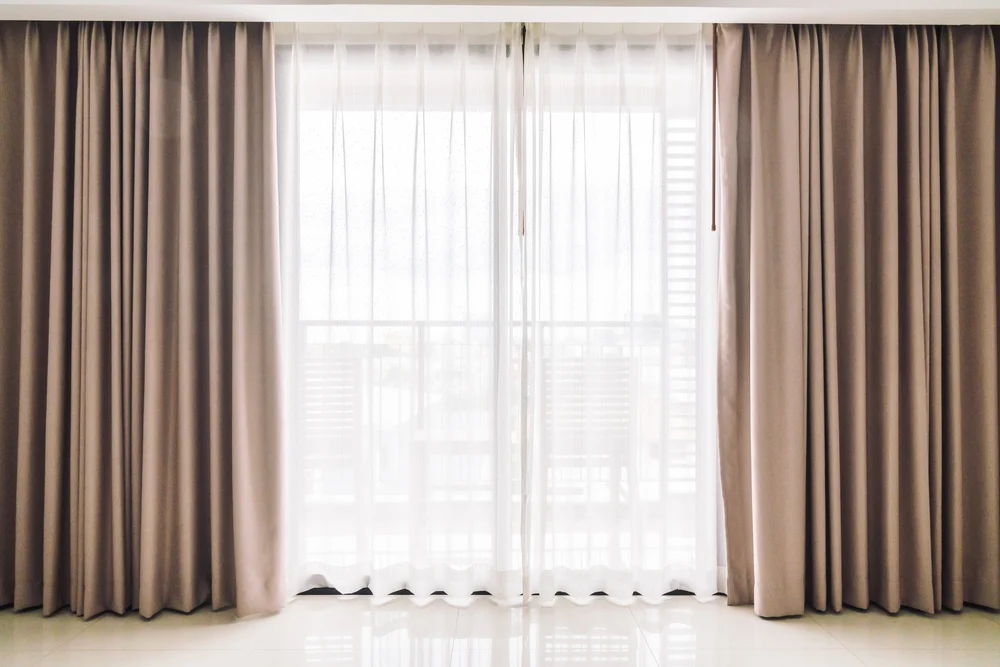 Clean curtains hanging neatly in a bright living room